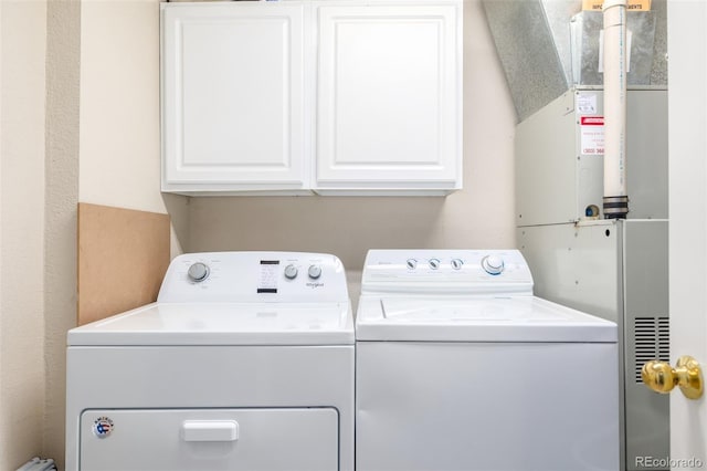 laundry area featuring cabinet space and independent washer and dryer