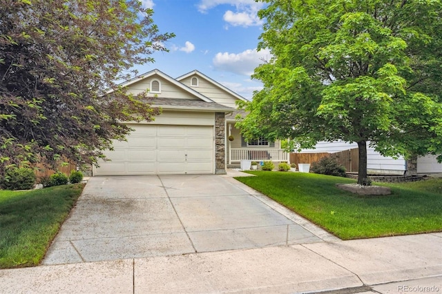 11418 Macon St, Commerce City, CO 80640 - view of front facade featuring concrete driveway, an attached garage, and a porch