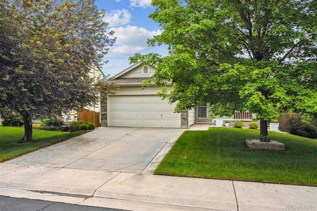 11418 Macon St, Commerce City, CO 80640 - view of property hidden behind natural elements featuring driveway, a garage, and stone siding