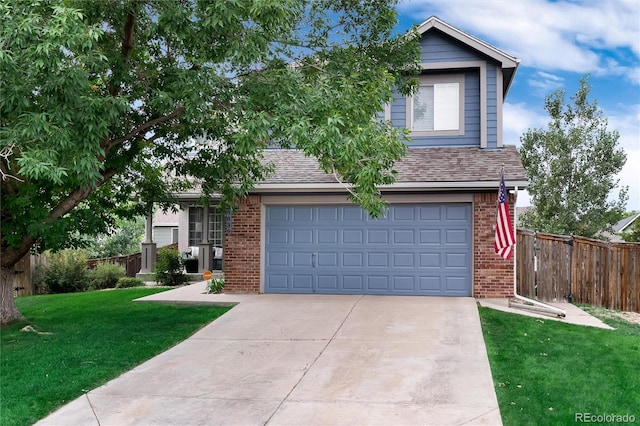 view of front facade with a front yard and a garage