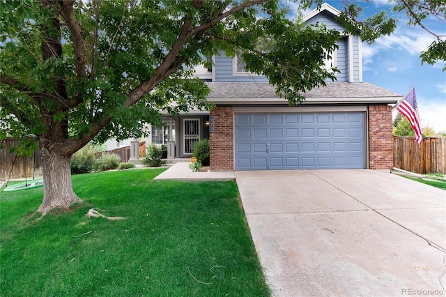 view of property hidden behind natural elements with a front lawn