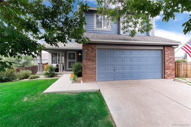 view of front facade with a front lawn and a garage