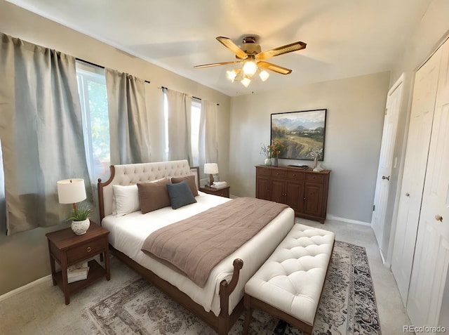 bedroom with multiple windows, a closet, and ceiling fan