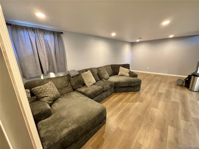 living room with light hardwood / wood-style flooring