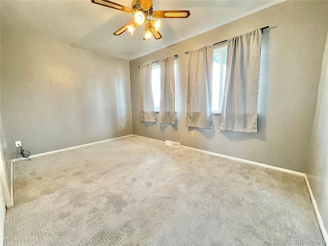 empty room with carpet and ceiling fan