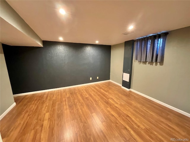 basement with wood-type flooring