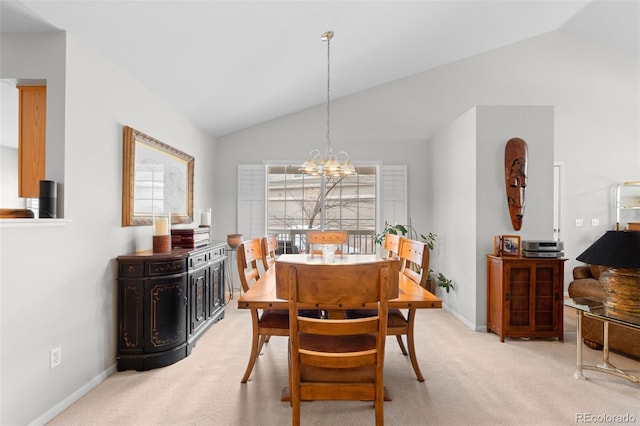 dining space with light colored carpet, vaulted ceiling, baseboards, and an inviting chandelier