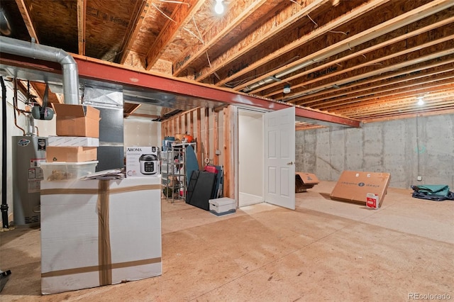 unfinished basement featuring water heater