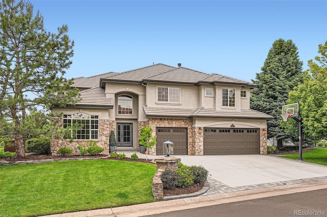 9445 Aspen Hill Cir, Lone Tree, CO 80124 - view of front of home with stone siding, a garage, a front yard, stucco siding, and driveway