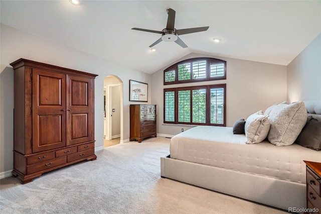9445 Aspen Hill Cir, Lone Tree, CO 80124 - bedroom with arched walkways, vaulted ceiling, light colored carpet, baseboards, and a ceiling fan