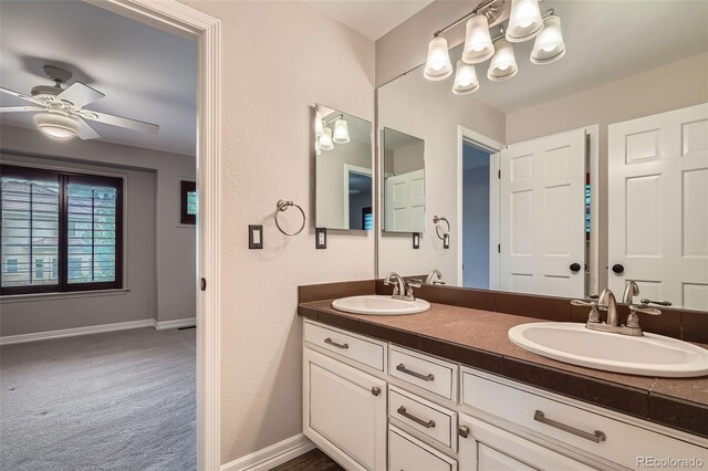 9445 Aspen Hill Cir, Lone Tree, CO 80124 - bathroom featuring double vanity and ceiling fan