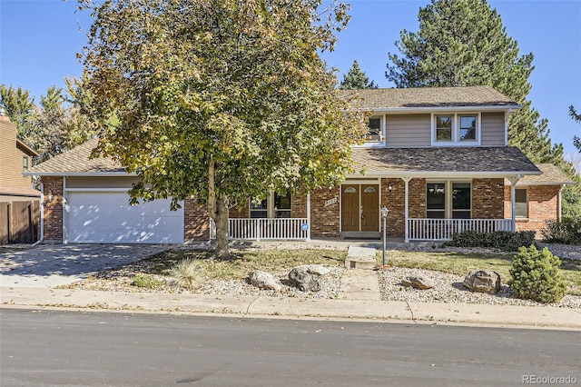 view of front of property featuring a garage and covered porch