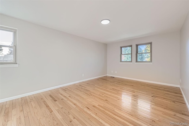 spare room with light wood-type flooring