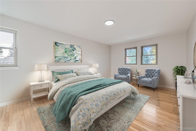 bedroom with hardwood / wood-style flooring