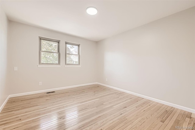 unfurnished room featuring light hardwood / wood-style floors