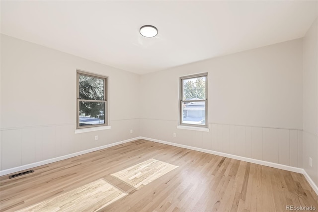 unfurnished room featuring light hardwood / wood-style flooring