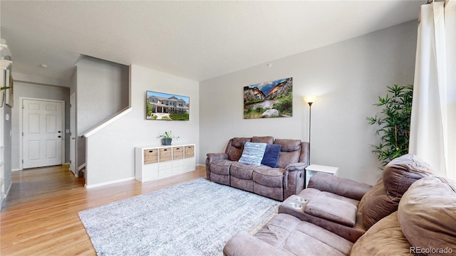 9758 Laredo St Unit 22D, Commerce City, CO 80022 - living room with baseboards and light wood-type flooring