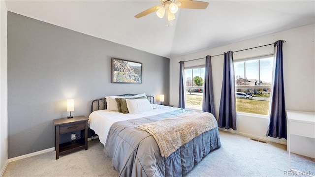 9758 Laredo St Unit 22D, Commerce City, CO 80022 - bedroom with lofted ceiling, light carpet, baseboards, and visible vents