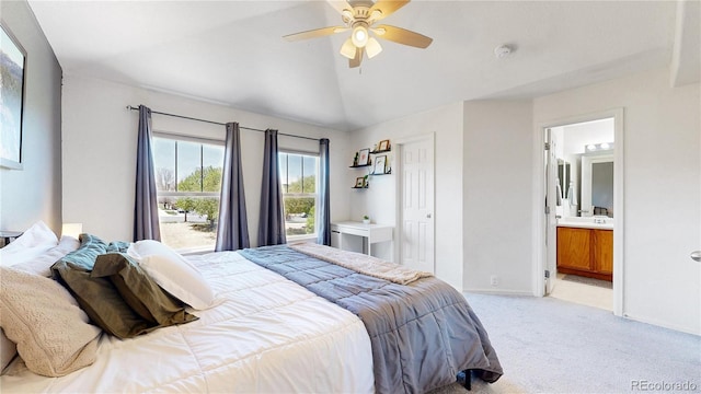 9758 Laredo St Unit 22D, Commerce City, CO 80022 - bedroom featuring light colored carpet, vaulted ceiling, ceiling fan, connected bathroom, and baseboards