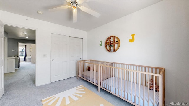 9758 Laredo St Unit 22D, Commerce City, CO 80022 - bedroom with a nursery area, carpet floors, a closet, and a ceiling fan