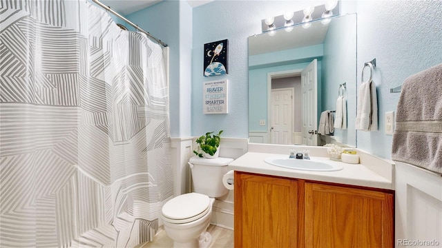 9758 Laredo St Unit 22D, Commerce City, CO 80022 - bathroom with curtained shower, vanity, and toilet