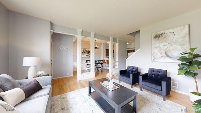 9758 Laredo St Unit 22D, Commerce City, CO 80022 - living room with ornate columns and wood finished floors