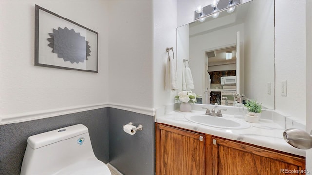 9758 Laredo St Unit 22D, Commerce City, CO 80022 - bathroom featuring toilet and vanity