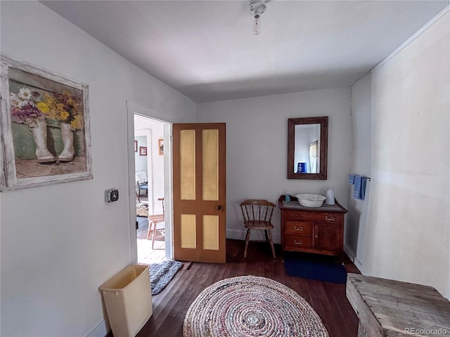 316 S Main, Bonanza, CO 81155 - foyer featuring dark wood-style floors and baseboards