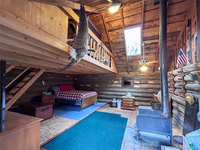 bedroom featuring wooden ceiling, vaulted ceiling, a wood stove, and rustic walls