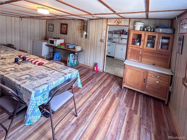 316 S Main, Bonanza, CO 81155 - dining room with wood finished floors and wooden walls
