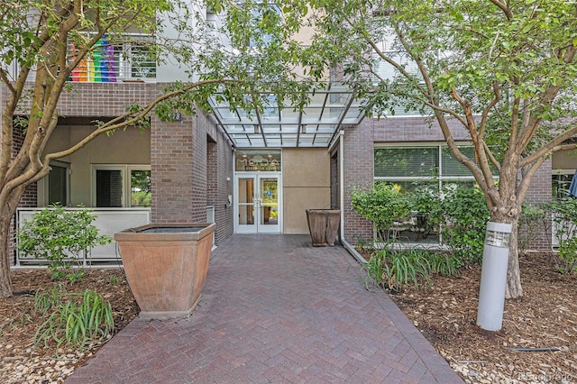2958 Syracuse St Unit 403, Denver, CO 80238 - exterior space with french doors, stucco siding, brick siding, and a patio