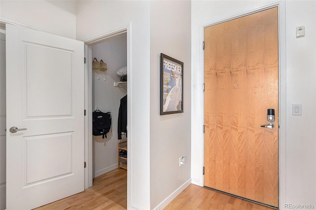 2958 Syracuse St Unit 403, Denver, CO 80238 - entryway with light wood-style floors and baseboards