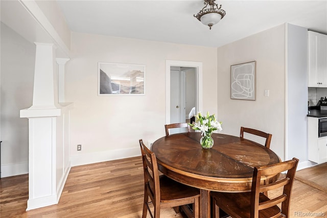 2676 S Lincoln St, Denver, CO 80210 - dining room featuring baseboards and light wood finished floors