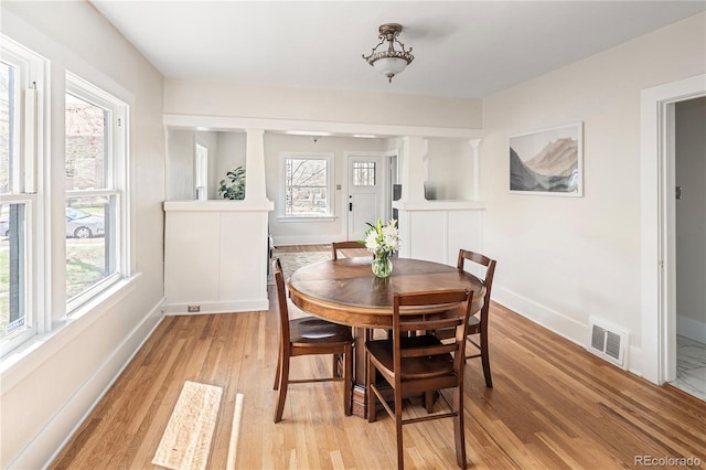 2676 S Lincoln St, Denver, CO 80210 - dining area featuring visible vents, light wood finished floors, and baseboards