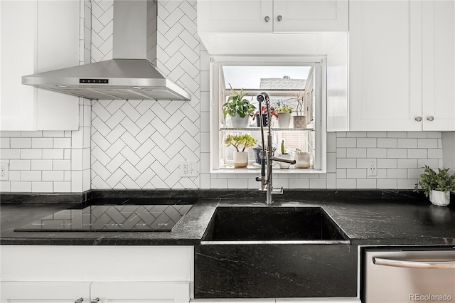 2676 S Lincoln St, Denver, CO 80210 - kitchen featuring dishwasher, wall chimney range hood, black electric cooktop, white cabinets, and backsplash