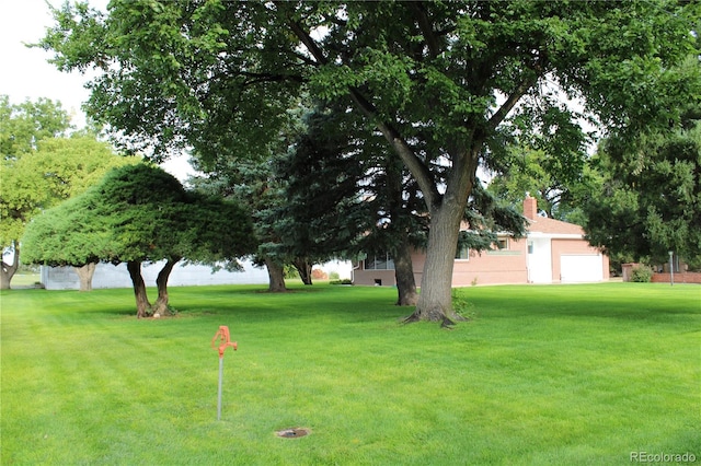 view of yard with a garage