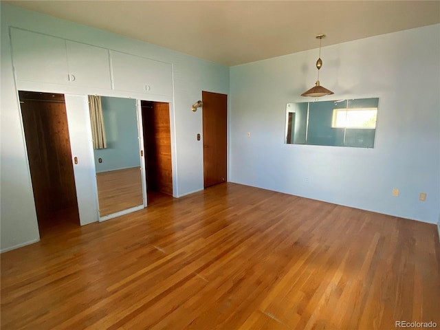 unfurnished bedroom featuring hardwood / wood-style floors