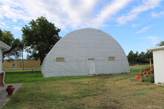 view of outdoor structure featuring a yard