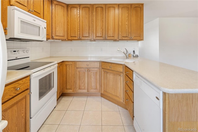 1840 E 84th Ave, Denver, CO 80229 - kitchen featuring white appliances, a peninsula, backsplash, light tile patterned flooring, and light countertops