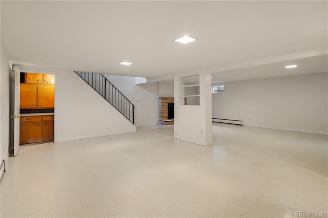 1840 E 84th Ave, Denver, CO 80229 - finished basement featuring a baseboard heating unit, a fireplace with raised hearth, stairs, light floors, and built in shelves