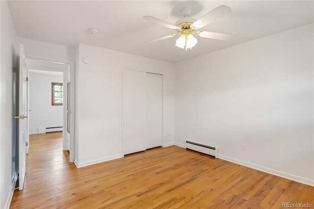 1840 E 84th Ave, Denver, CO 80229 - unfurnished bedroom with baseboard heating, light wood-style floors, and a closet