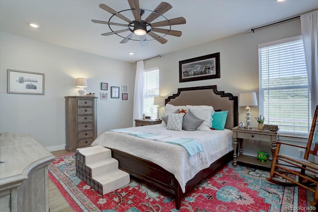 527 Felicity Loop, Castle Rock, CO 80109 - bedroom with light wood-type flooring, multiple windows, recessed lighting, and a ceiling fan