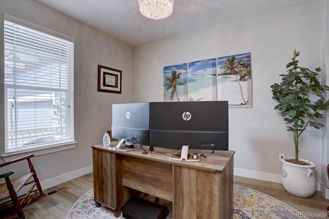 527 Felicity Loop, Castle Rock, CO 80109 - office featuring light wood finished floors, baseboards, and a chandelier