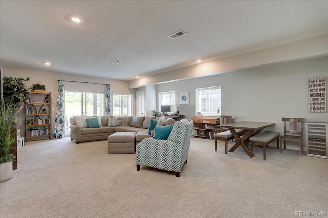 527 Felicity Loop, Castle Rock, CO 80109 - carpeted living area with wine cooler, plenty of natural light, and recessed lighting