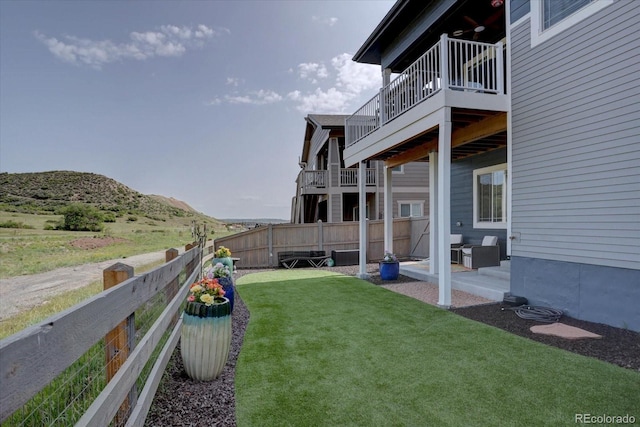 527 Felicity Loop, Castle Rock, CO 80109 - view of yard featuring a mountain view, a balcony, and a patio area