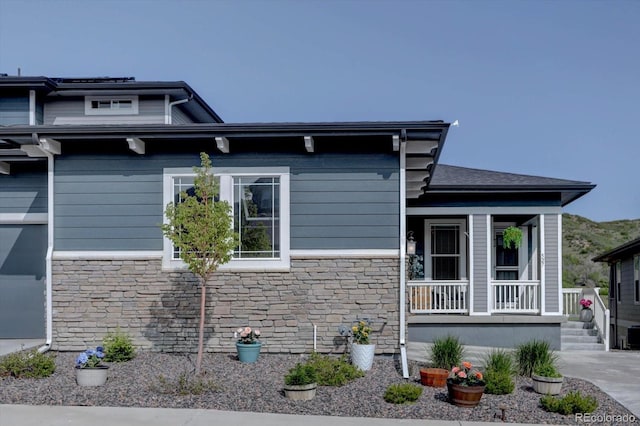 527 Felicity Loop, Castle Rock, CO 80109 - view of side of property featuring stone siding and a porch