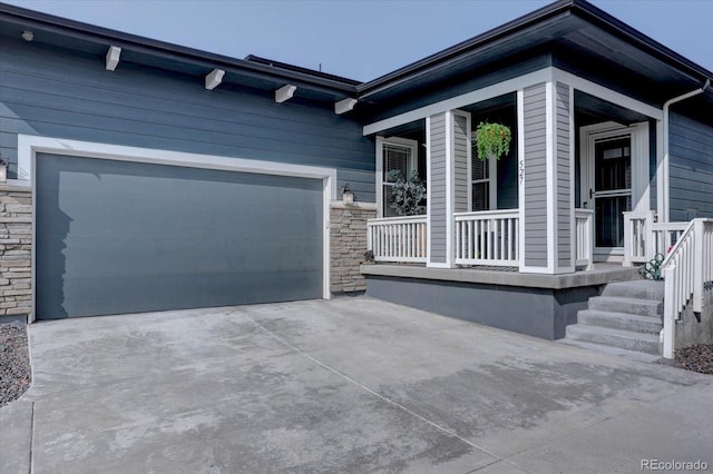 527 Felicity Loop, Castle Rock, CO 80109 - view of property exterior with stone siding, a porch, concrete driveway, and an attached garage
