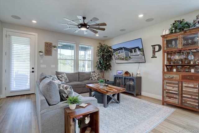 527 Felicity Loop, Castle Rock, CO 80109 - living area featuring light wood-style flooring, a ceiling fan, recessed lighting, and baseboards