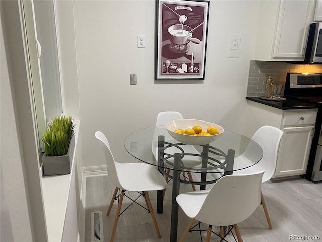 dining room featuring light hardwood / wood-style flooring