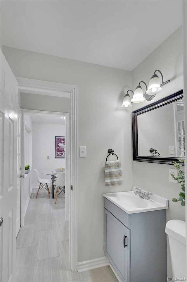 bathroom with toilet and vanity